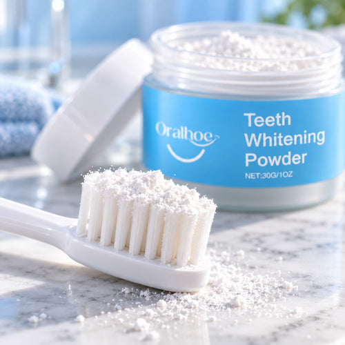 Whitening powder on a toothbrush next to the open jar